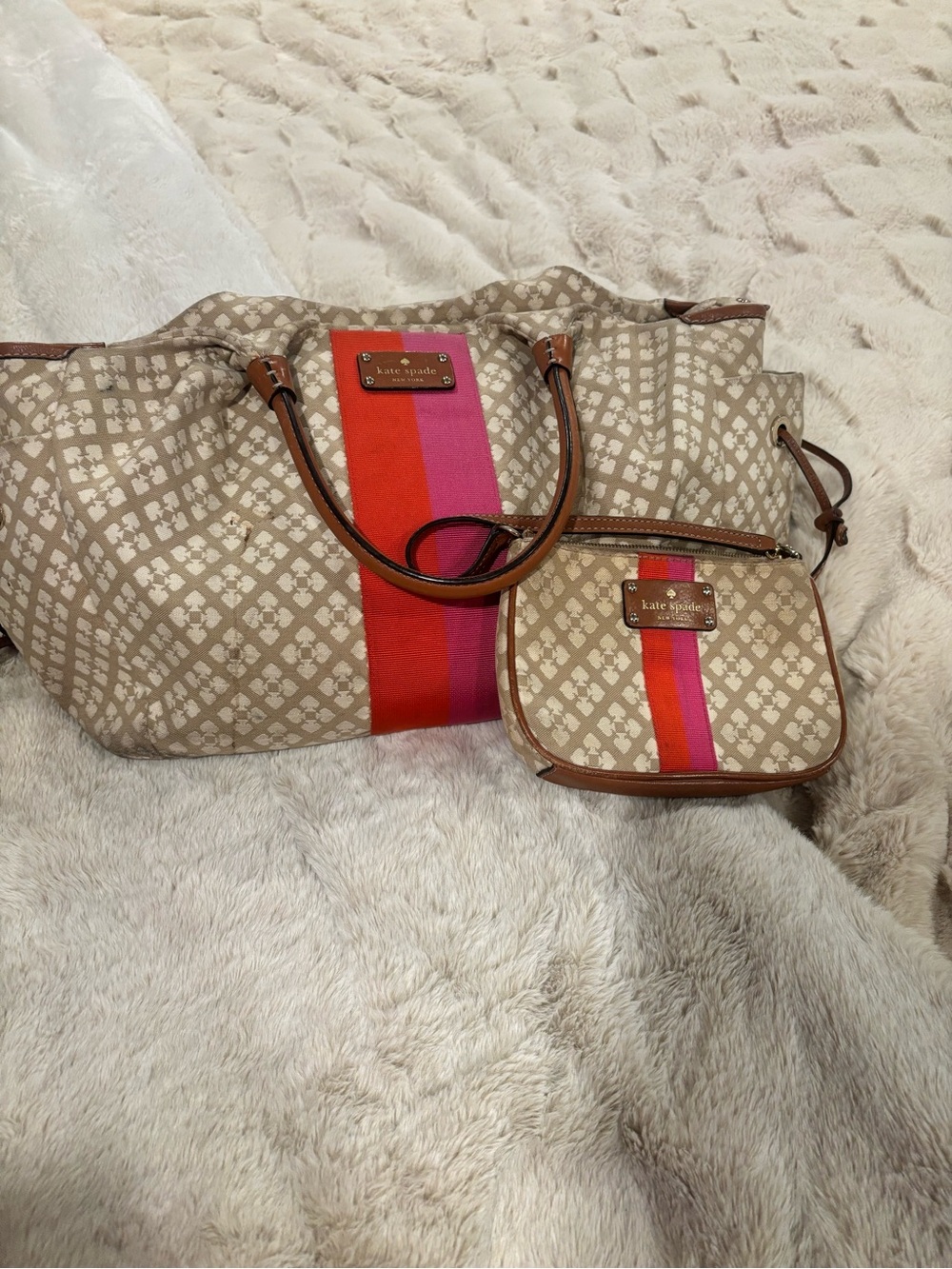 kate spade beige diaper bag with pink and red center stripe and leather trim